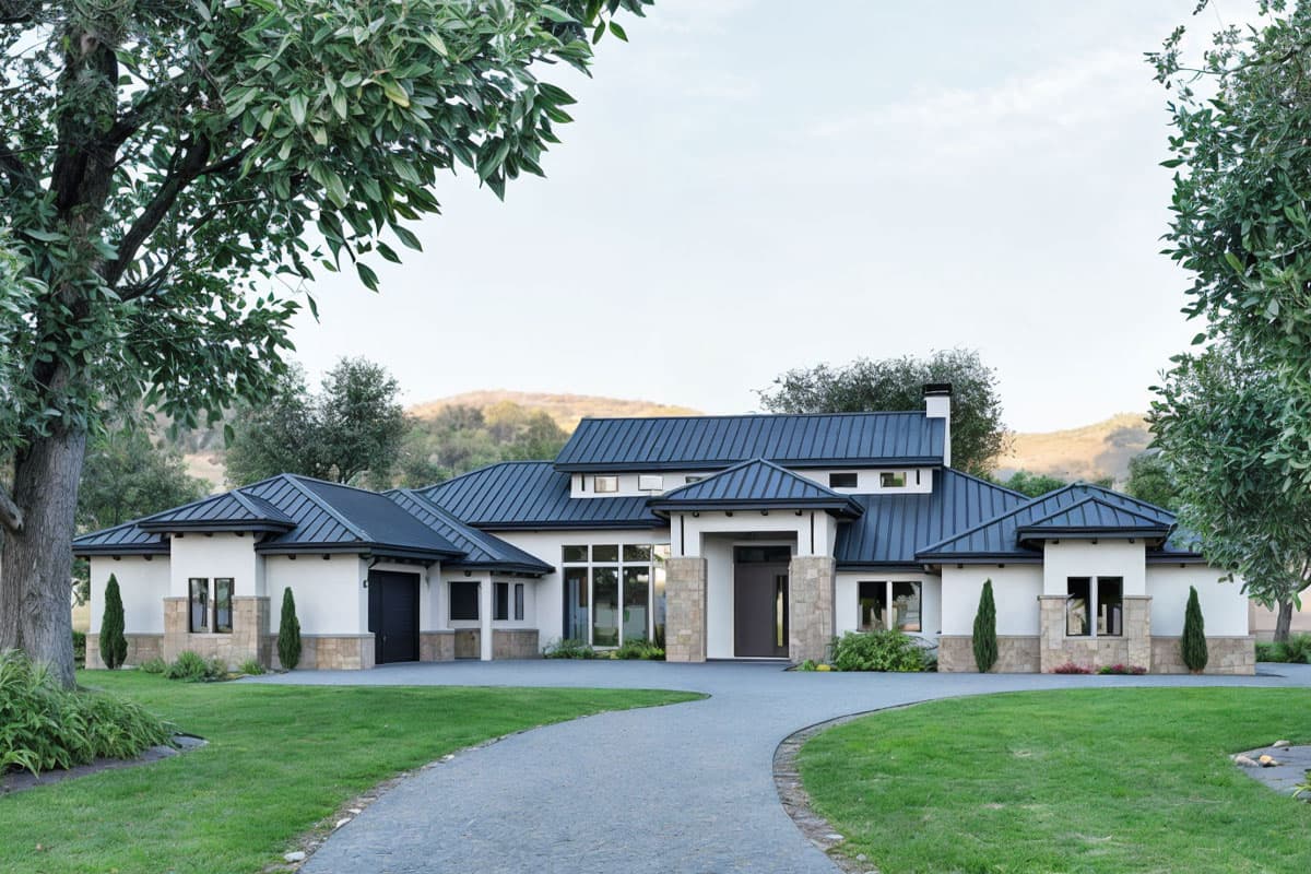 Modern house plan exterior featuring a dark metal roof, stone accents, large windows, and a side-entry garage.