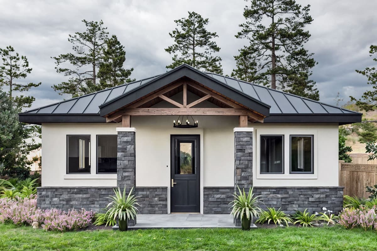 House plan exterior. One-story Craftsman home with a metal roof, front porch with exposed timber supports, and stone veneer accents.
