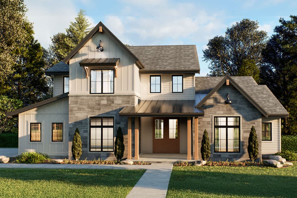 A two-story house with light-colored siding, dark-framed windows, and stone accents. The home has a welcoming porch and well-manicured lawn.
