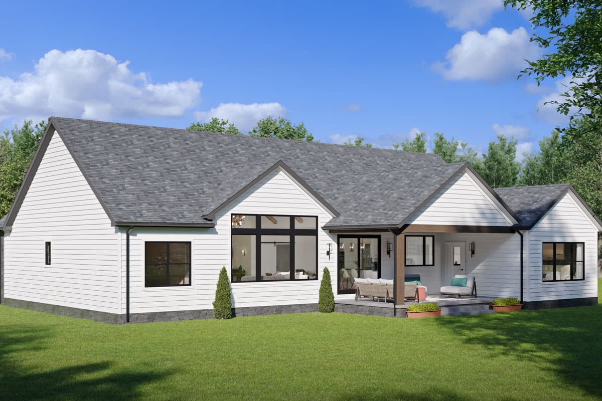 Modern Farmhouse house plan exterior: one story, white siding, gabled roof, covered porch with wood beams, and large windows.