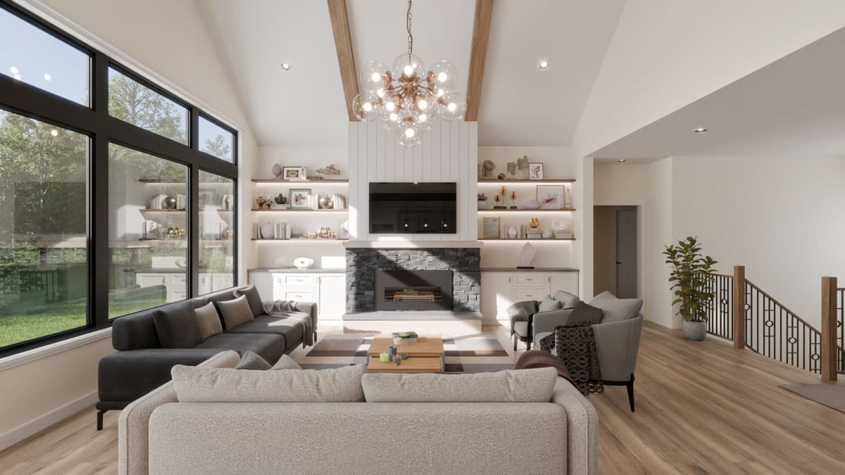 Living room with vaulted ceiling, stone fireplace, wall-mounted television, and large windows.