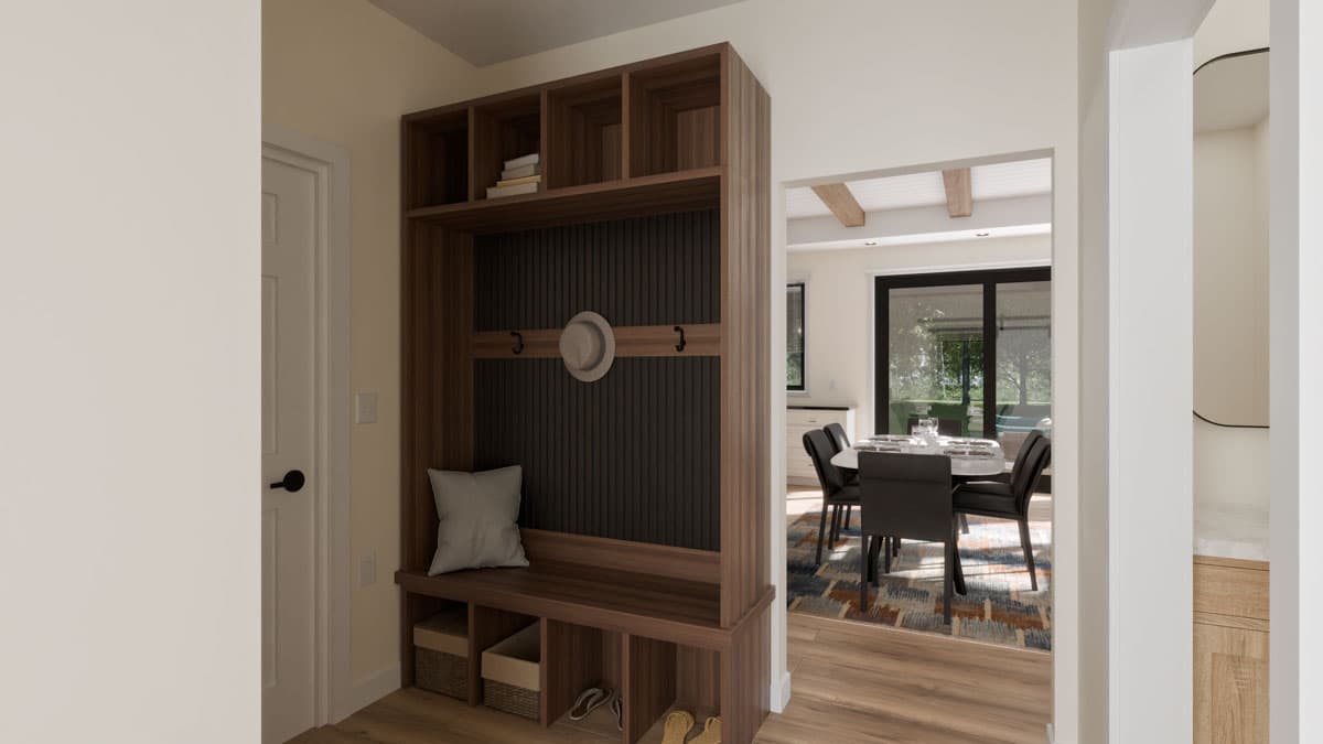 Mudroom bench and cubby system with open shelving and coat hooks. Dining area with table and chairs visible beyond.