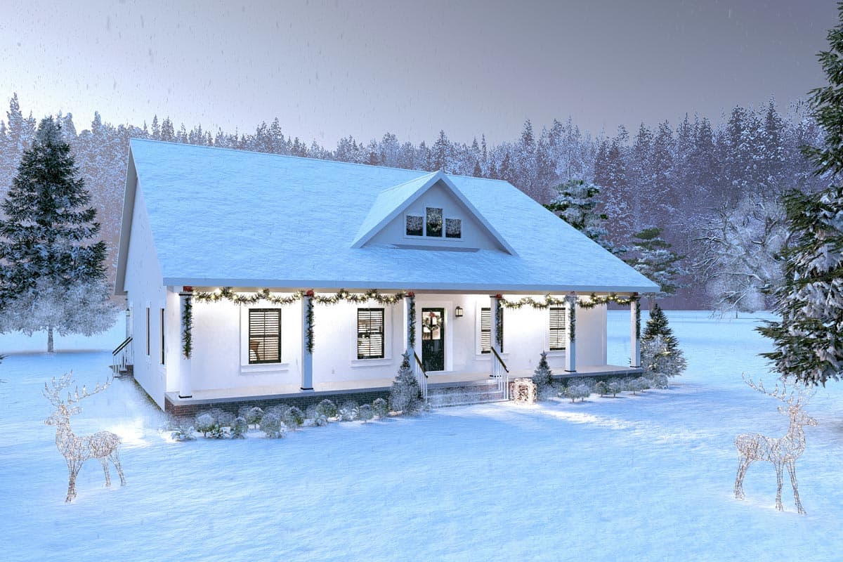 A snowy, white house decorated for Christmas, with garland, lit reindeer, and lights. The house is surrounded by snow-covered trees.