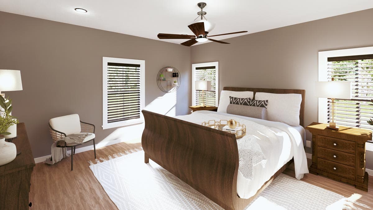 A warm, inviting bedroom with a dark wooden bed, white bedding, and two bedside tables. Natural light streams through the windows.