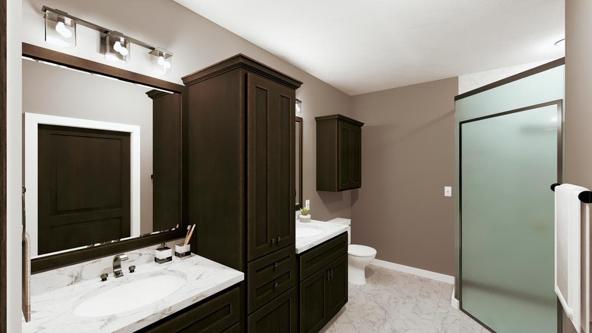 Modern bathroom with dark wood cabinets, a marble-topped vanity, and a glass-enclosed shower. Clean, minimalist design with neutral colors.