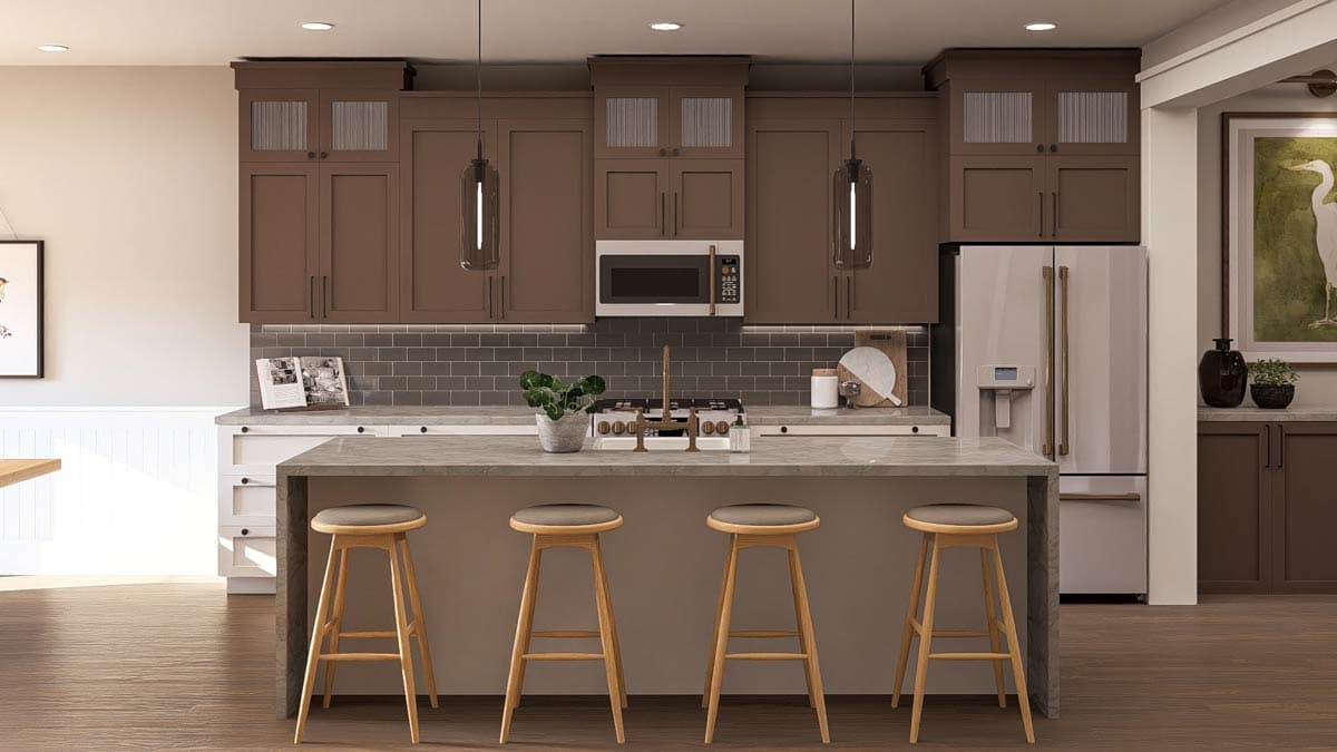 Kitchen with brown cabinetry, large island with seating, stainless steel appliances including a French door refrigerator and range.