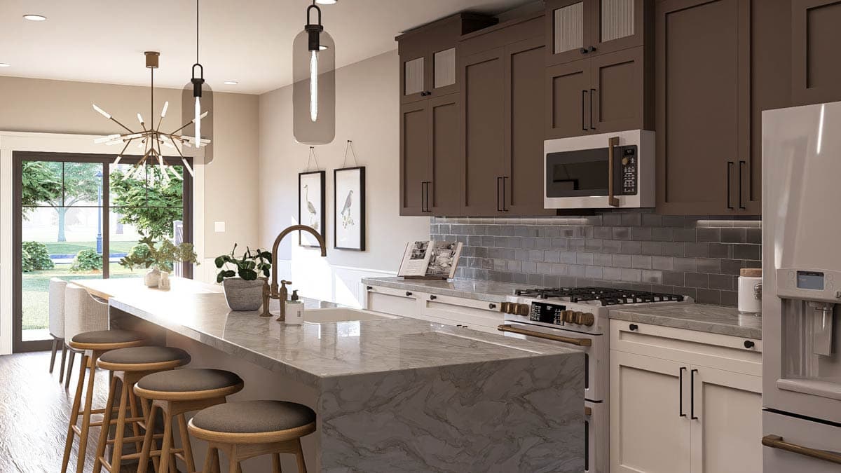 Kitchen interior with large island, marble countertops, dark brown cabinets, subway tile backsplash, and stainless steel appliances.