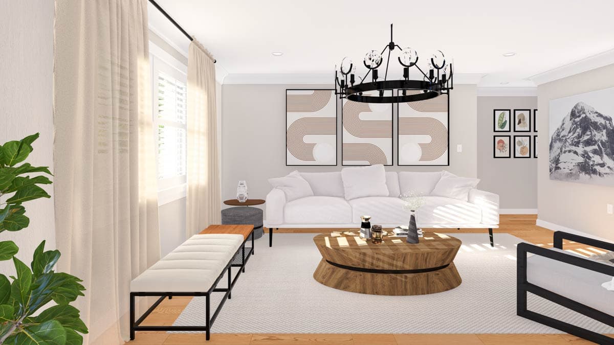 Living room with white sofa, round wood coffee table, bench seating, floor-to-ceiling sheer curtains, and abstract wall art.