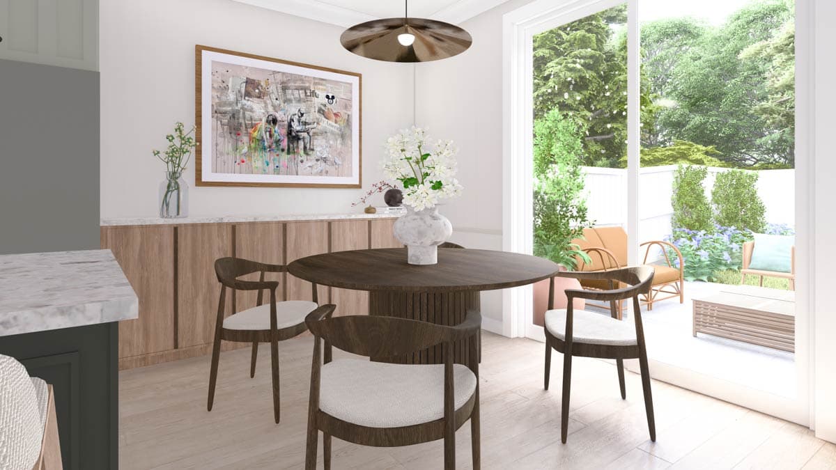 Dining area with round table, chairs, and large sliding glass doors opening to a patio with outdoor seating.