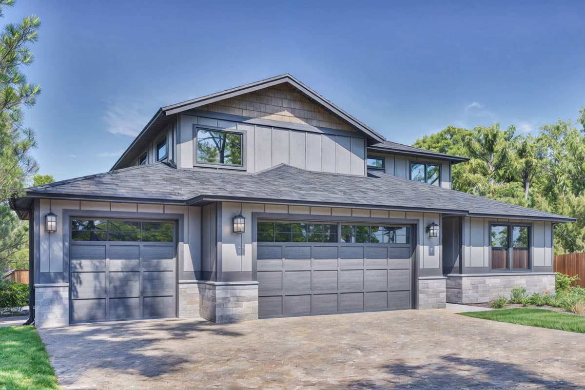 Modern two-story house plan exterior with a three-car garage, mixed siding, and dark stone accents.