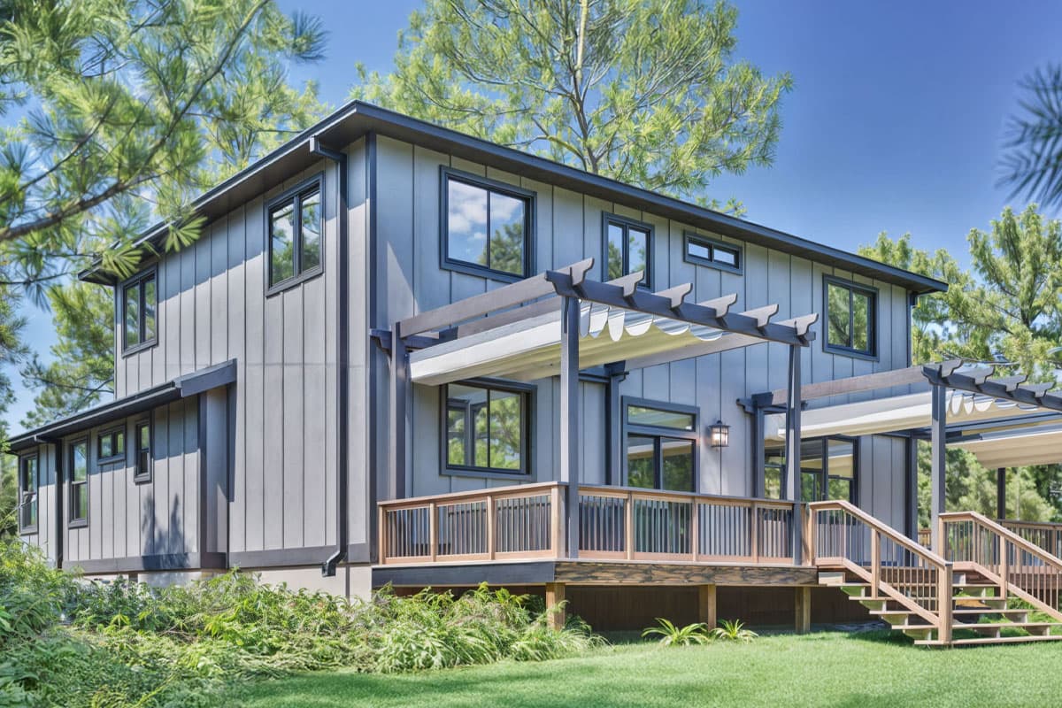 House plan exterior view of a two-story modern home with vertical siding, a deck, pergolas, and multi-pane windows.