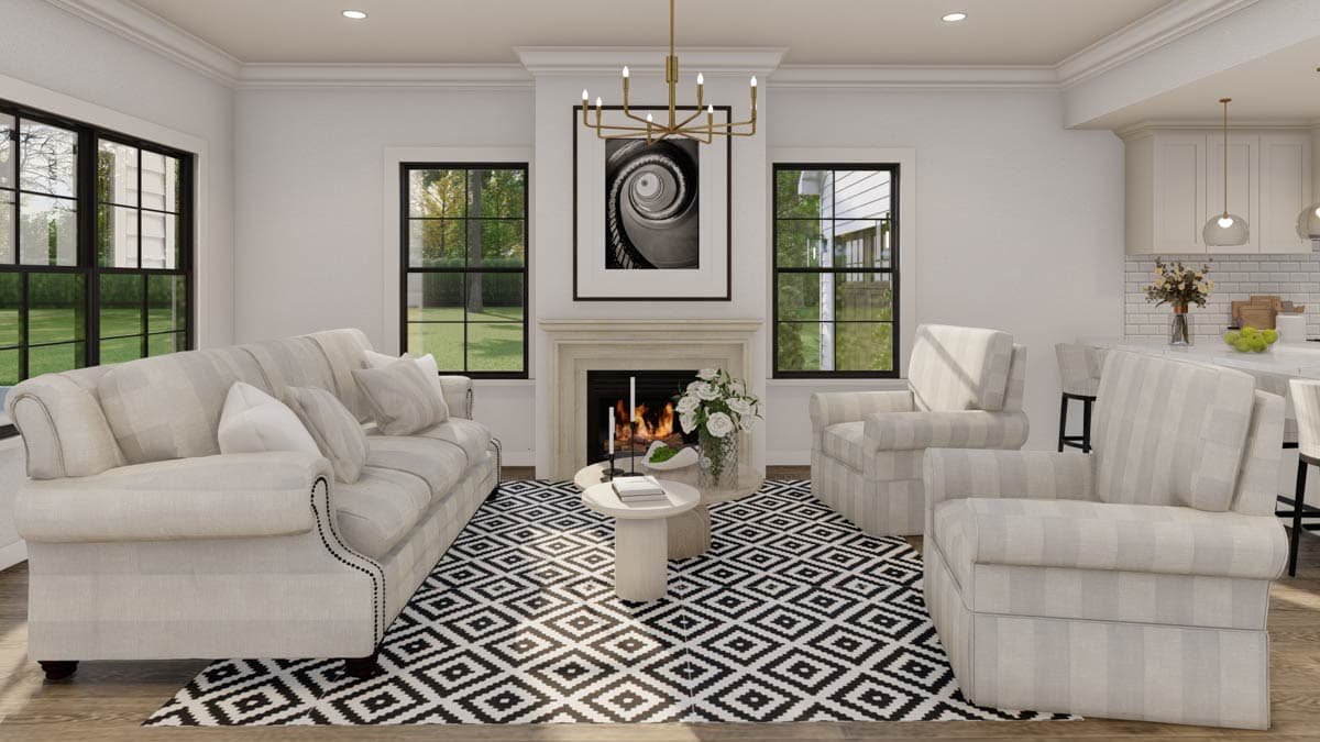 Living room with fireplace, sofa, two armchairs, patterned rug, and adjacent kitchen counter with stools.