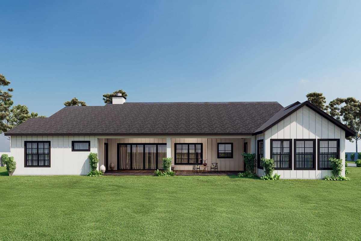 House plan exterior of a one-story Modern Farmhouse with a covered porch, gables, and large grid windows.