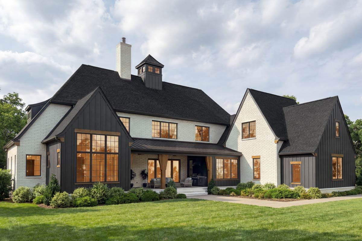 House plan exterior: Two-story Modern Farmhouse with white brick, dark gables, covered porch, and prominent chimney.