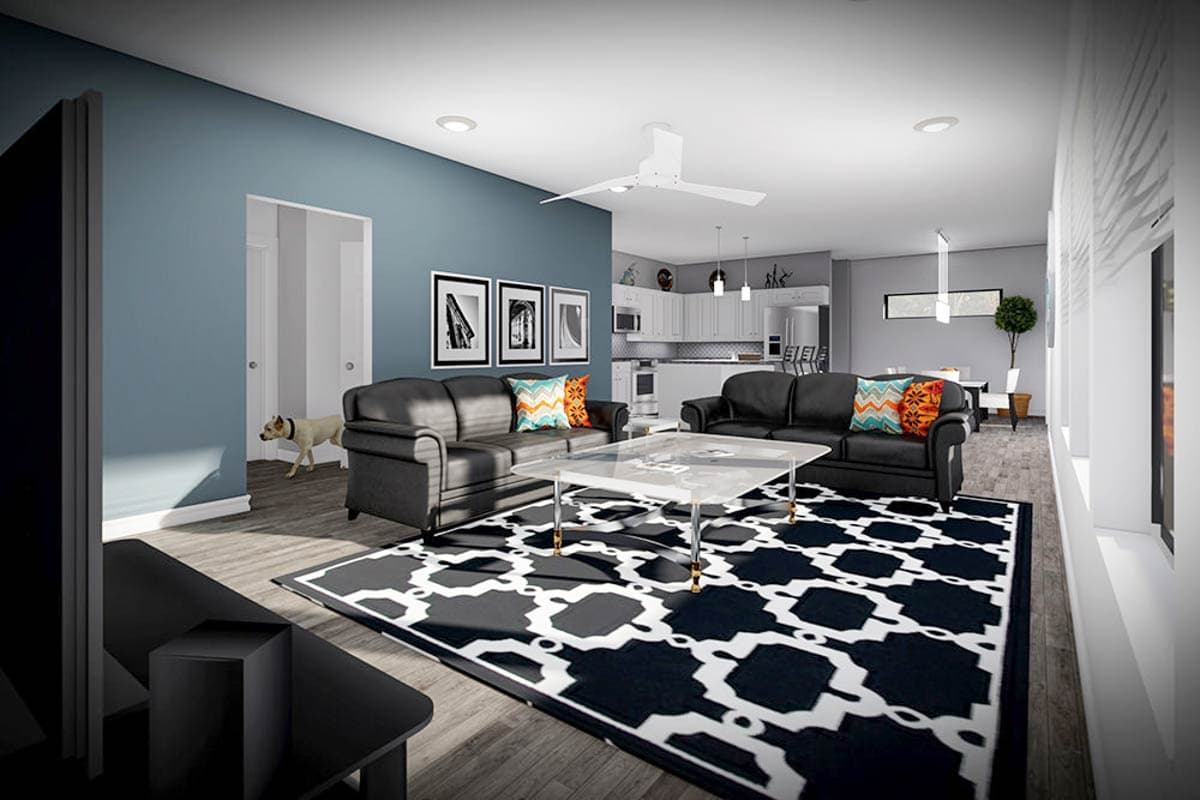 Interior rendering of a living room with black sofas, geometric rug, coffee table, and open kitchen beyond.