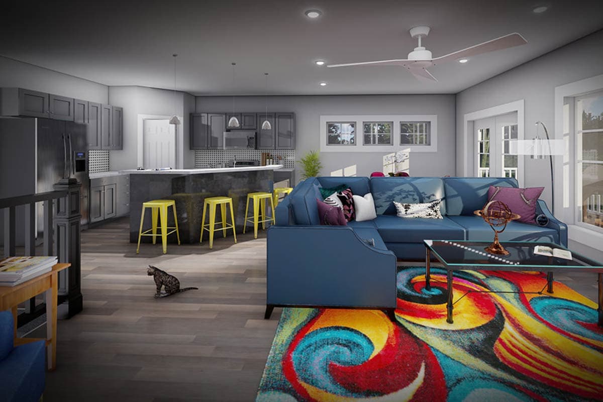 Interior rendering of open-concept living area and kitchen with blue sectional sofa, island with bar stools, and gray cabinetry.