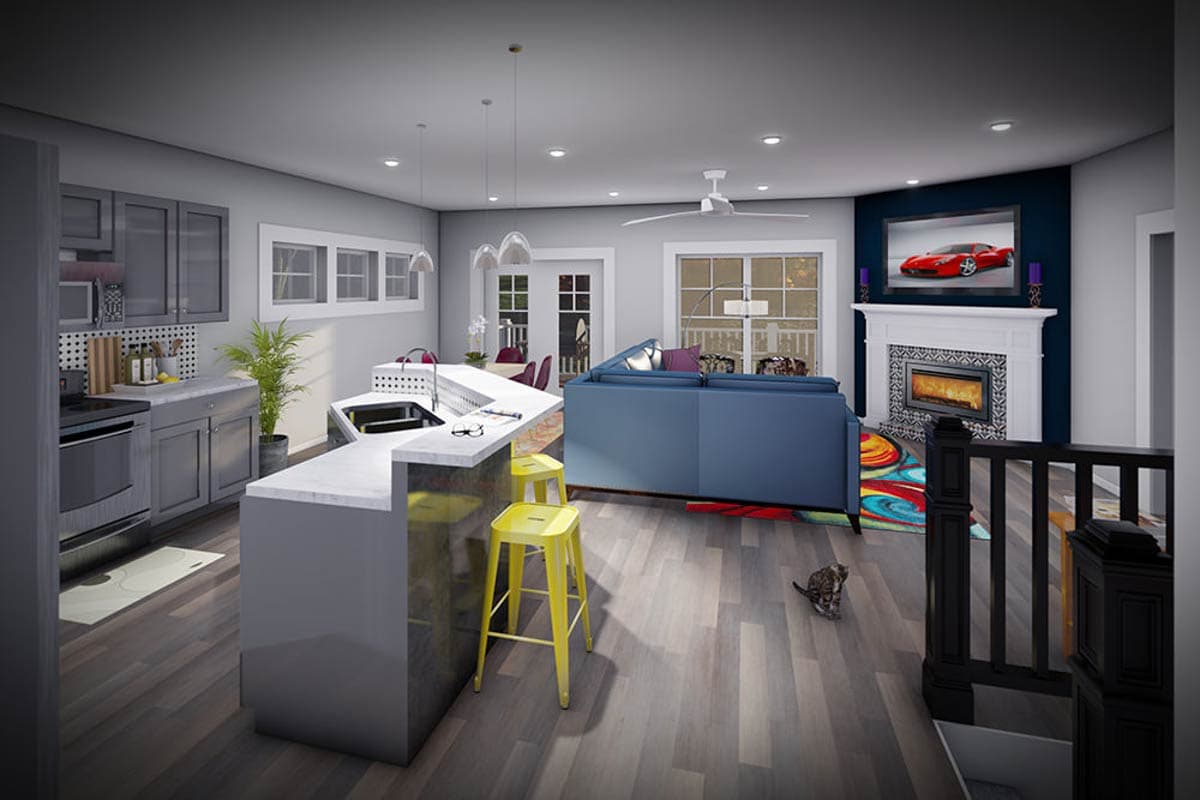 Open concept living area with a modern kitchen featuring an island, and a living room with a fireplace and television.