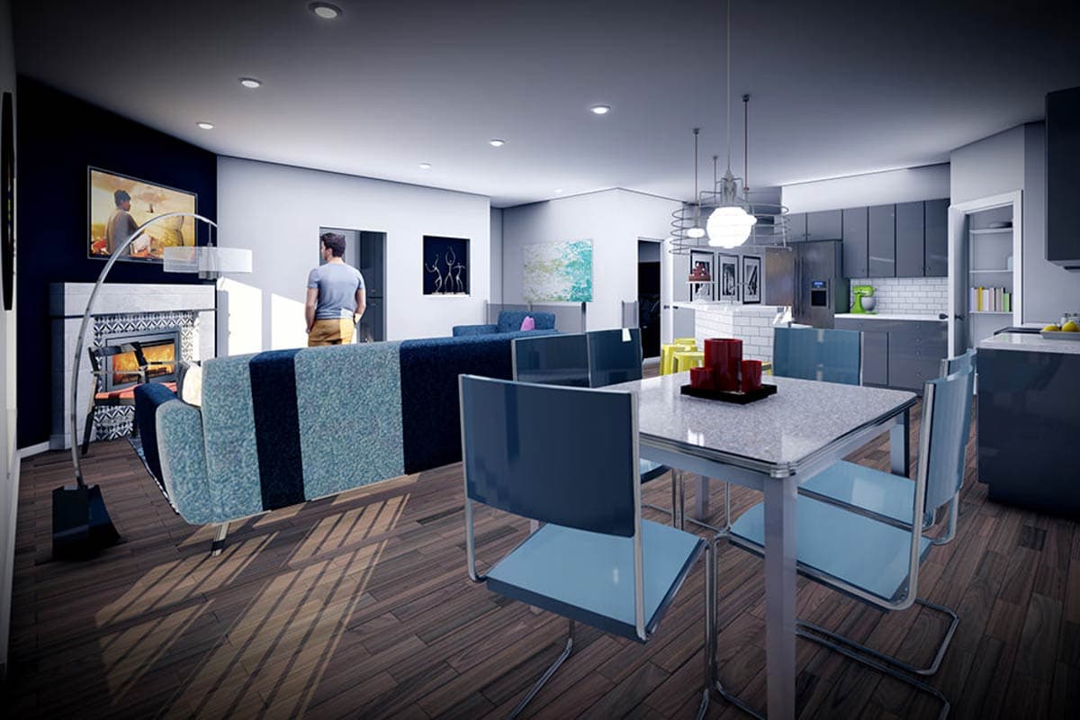 Modern open-concept living, dining, and kitchen with fireplace, island, and gray cabinetry.