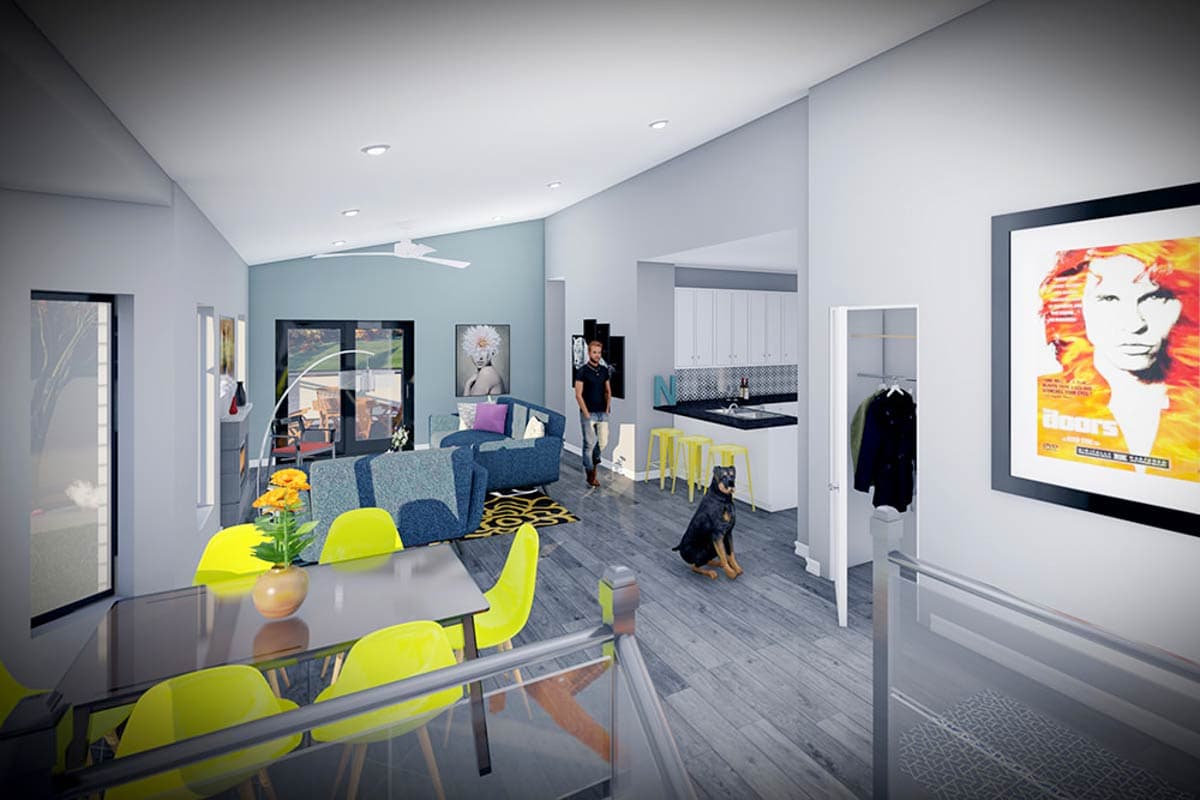 Open concept living area with vaulted ceiling, fireplace, kitchen with island and bar seating, and dining area.