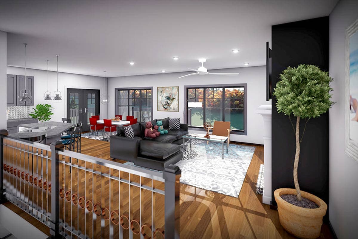 Open-concept living area with kitchen island, dining table, sectional sofa, fireplace, and large windows.