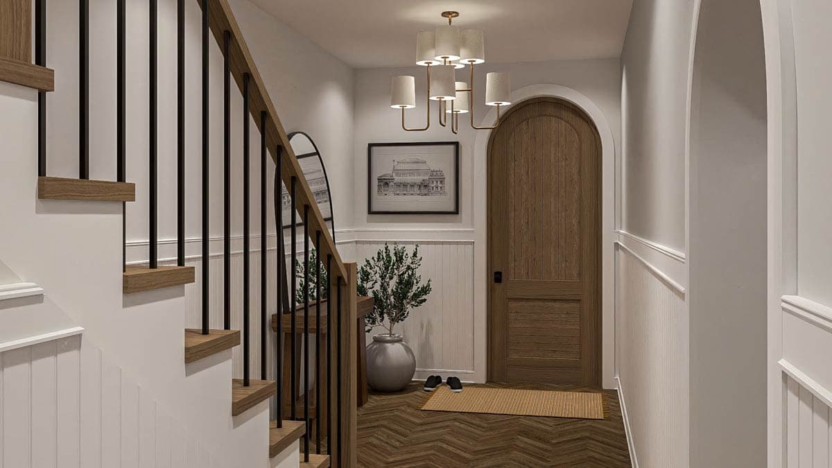 Interior rendering of a staircase with black balusters and wood treads, leading to an arched wood door and wainscoting.