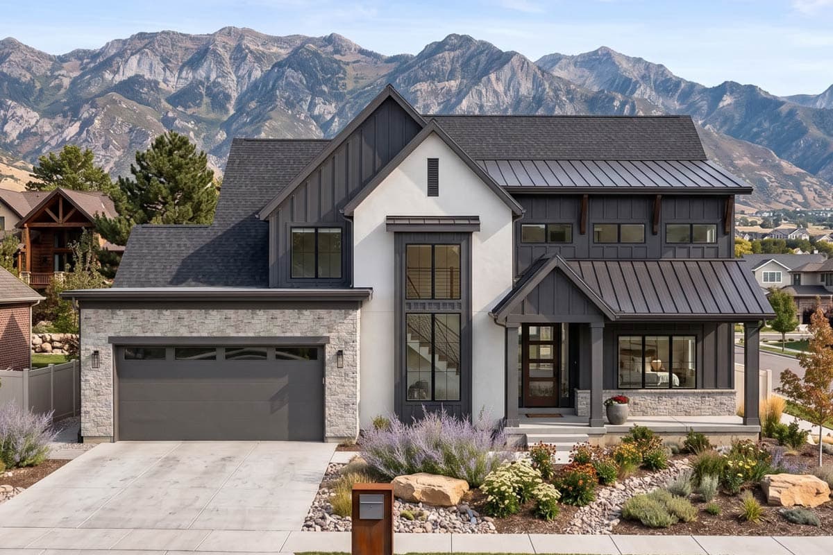 Modern Farmhouse two-story house plan exterior with metal roof, stone accent garage, and tall entryway windows.