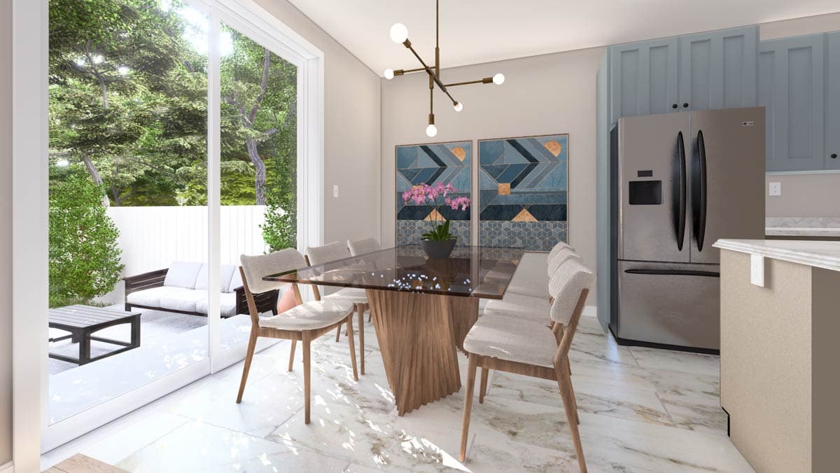 Dining area with glass table and chairs, adjacent to kitchen with stainless steel refrigerator and large sliding glass doors opening to patio.