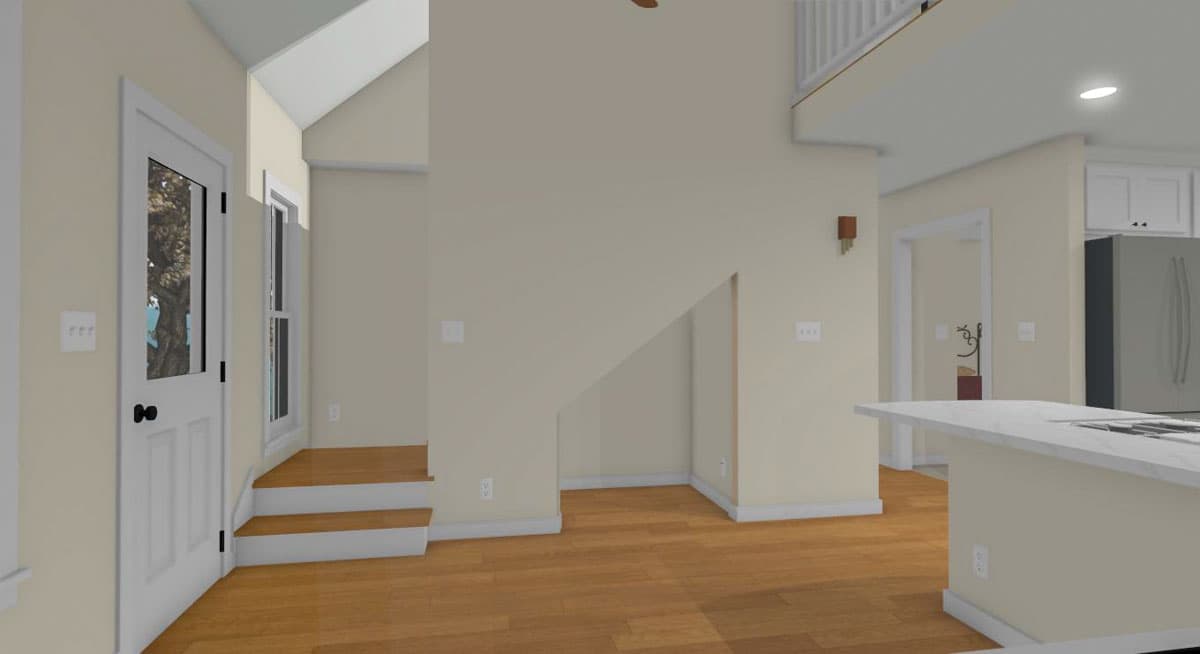 Interior view of house plan showing a staircase, kitchen island, and entryway with door and windows.