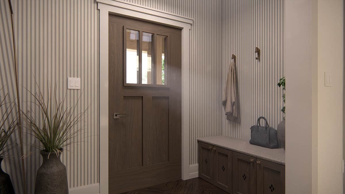 Interior view of a mudroom featuring a wooden door with glass panes, built-in bench with storage, and striped wallpaper.
