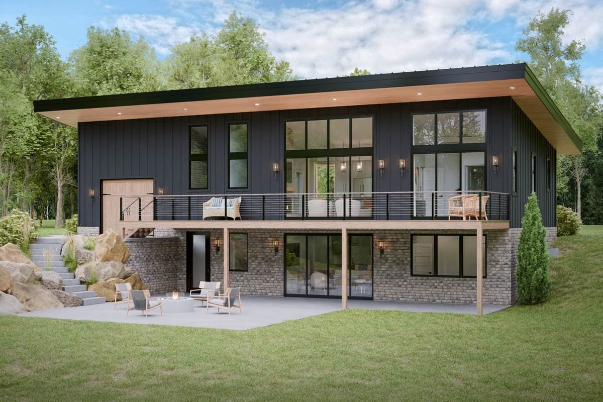 House plan exterior with two stories, flat roof, and a deck with metal railing. Features include stone accents and large windows.