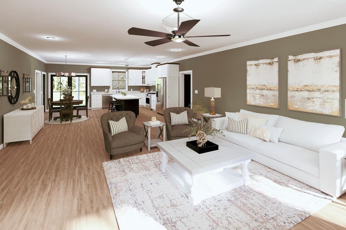 Open concept living area with kitchen island, dining space, and fireplace.