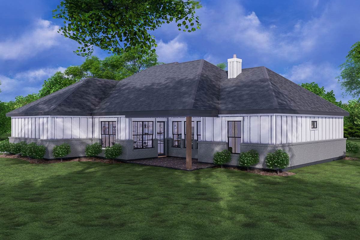 House plan exterior: A one-story home with a brick base, extensive windows, gabled rooflines, and a covered patio.