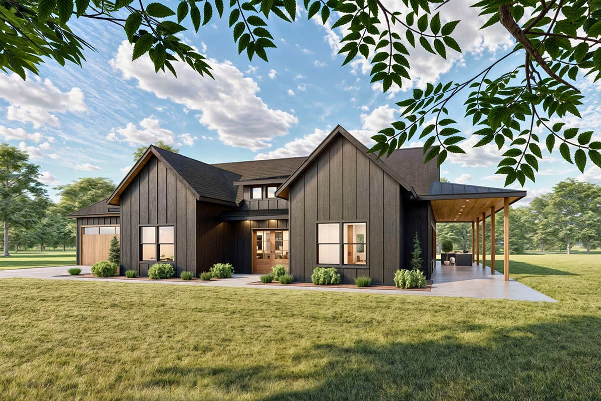 A modern, dark-gray farmhouse with a covered porch and wooden accents sits on a large grassy lawn, beneath a bright blue sky.