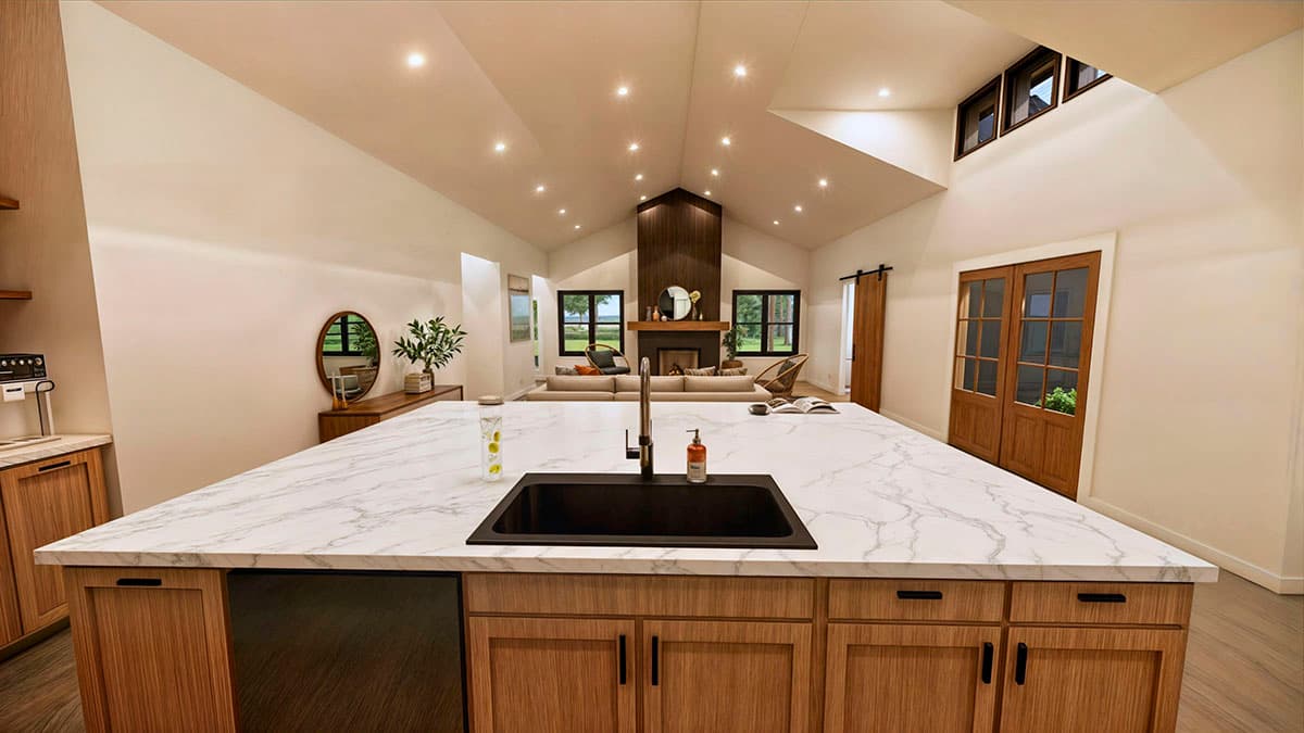 Spacious, modern kitchen with a large marble-topped island, a black sink, and wooden cabinets. The living room and a fireplace are in the background.