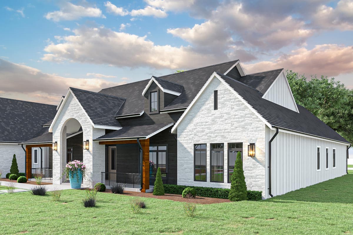 Modern Farmhouse house plan exterior with a prominent arched entry, white brick and dark siding, multiple gables, and dormer.