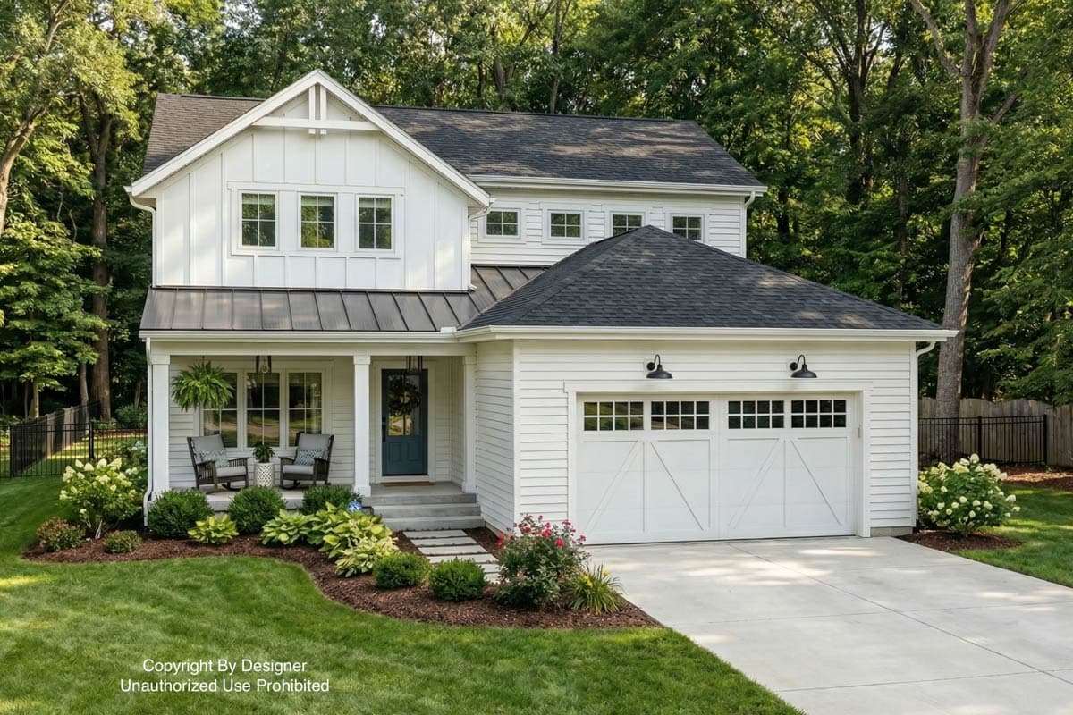 A white farmhouse with a dark roof and a landscaped yard. The house has a front porch with seating and a garage with white doors.