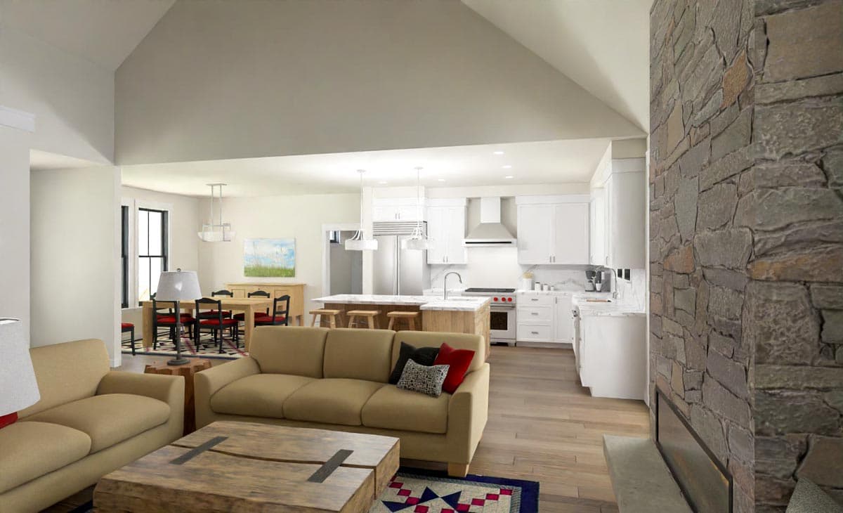A modern, open-plan living space features a kitchen, dining area, and living room with a stone fireplace and neutral decor.