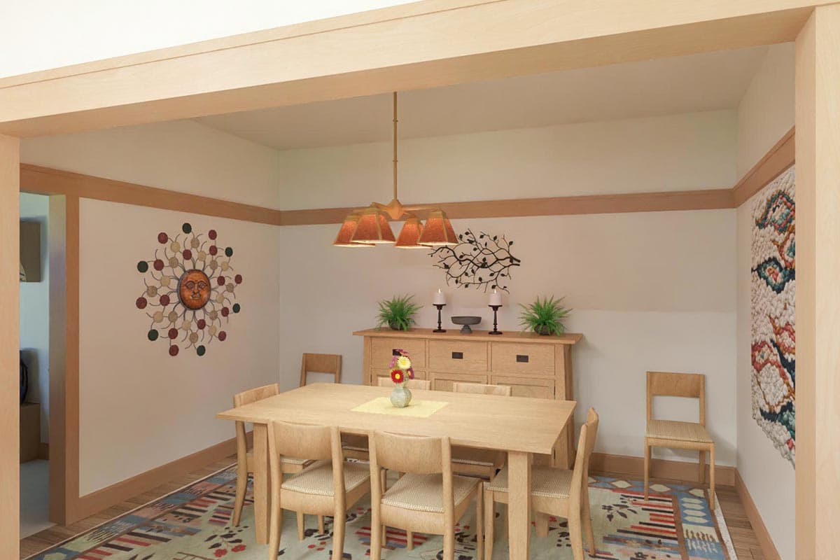 A well-lit dining room with a wooden table and chairs, a sideboard, and decorative wall art. A patterned rug lies beneath the furniture.