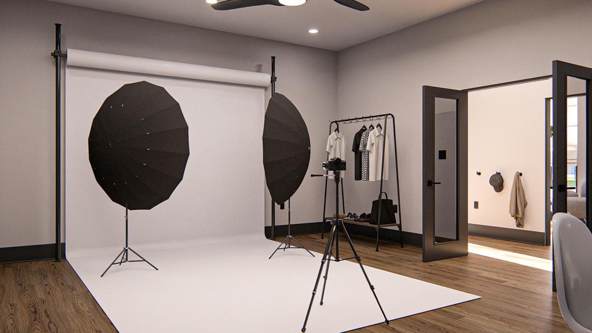 Interior rendering of a photography studio with backdrop, lighting equipment, camera on tripod, and clothing rack.