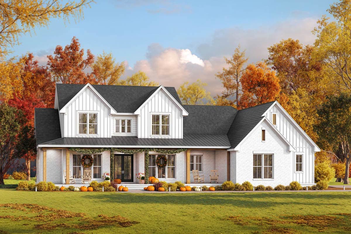 Farmhouse style house plan exterior with two stories, gabled roof, a covered porch, and dormers. Features brick siding and a black metal roof.