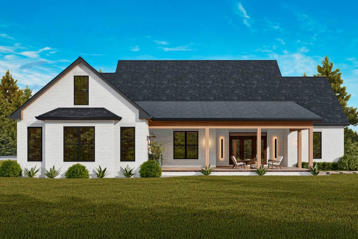 Modern Farmhouse exterior, white brick, large gable, covered porch with wooden posts, and dark-framed windows.