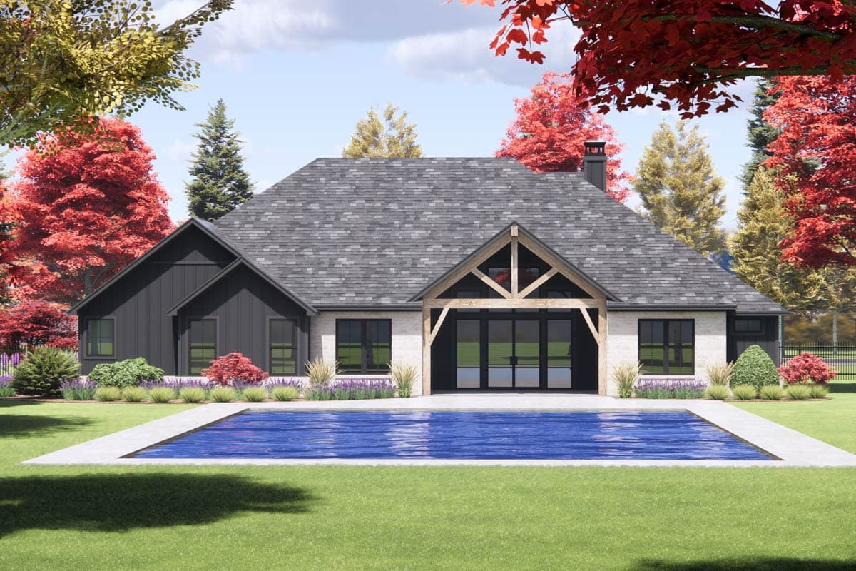House plan exterior with brick and dark siding, prominent gabled roof with exposed beams over sliding glass doors, and swimming pool.