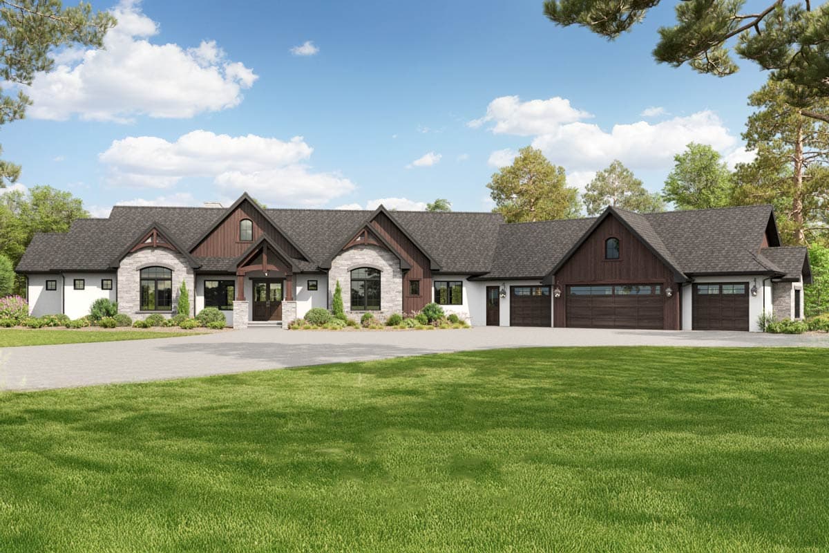 House plan exterior featuring a mixed material façade, multiple gables, arched windows, and a multi-car garage with a side-entry orientation.