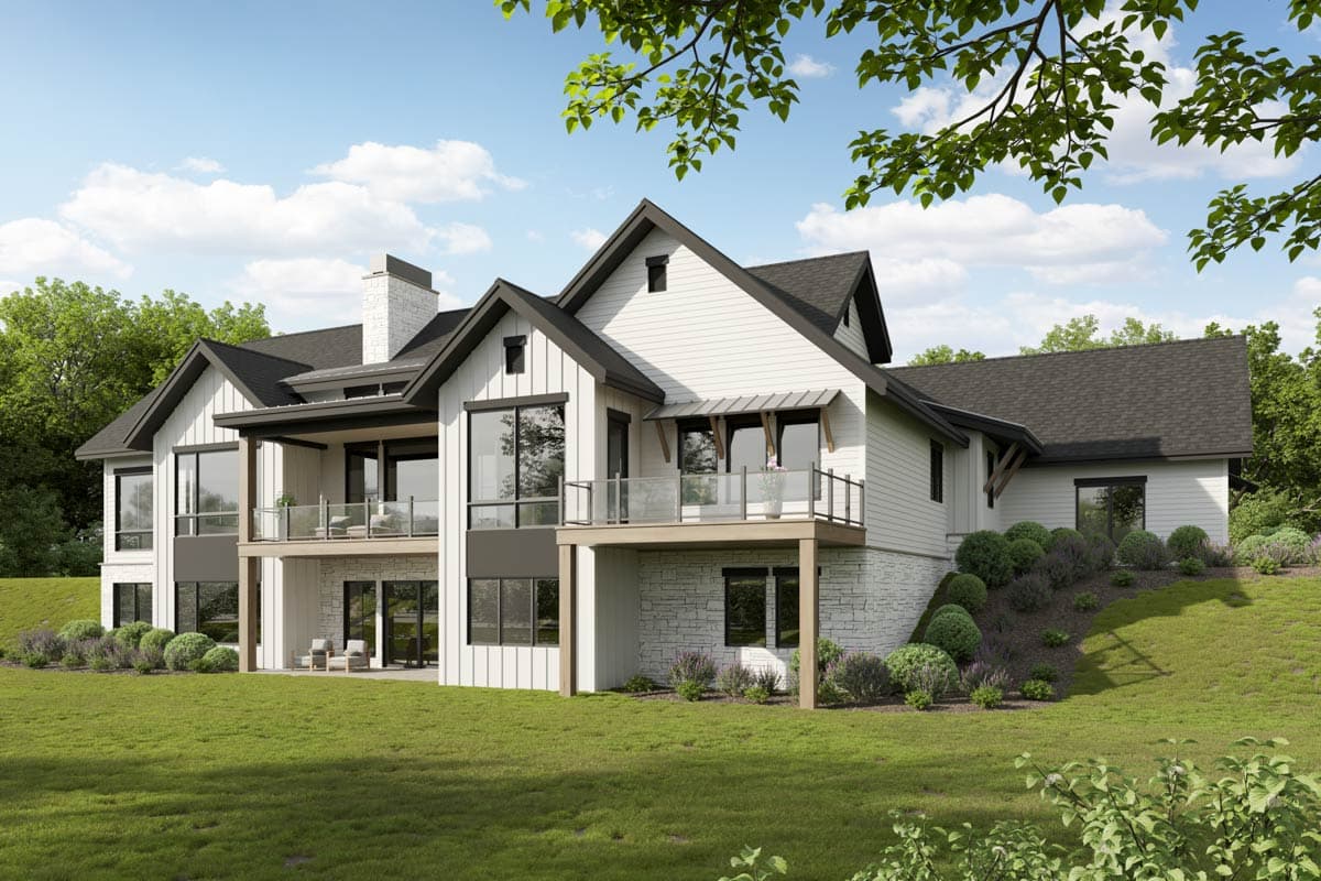 Modern Farmhouse house plan exterior with multiple gables, white board and batten siding, stone base, and balconies.