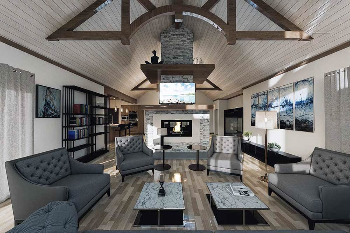 Interior rendering of a great room with vaulted beamed ceiling, stone fireplace, and open-concept kitchen visible in background.