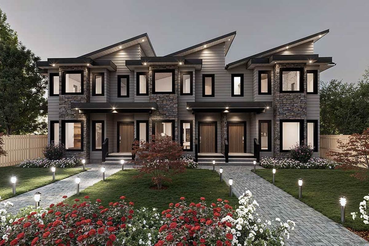 Modern townhouse exterior with asymmetrical gables, stone accents, and multi-story windows.