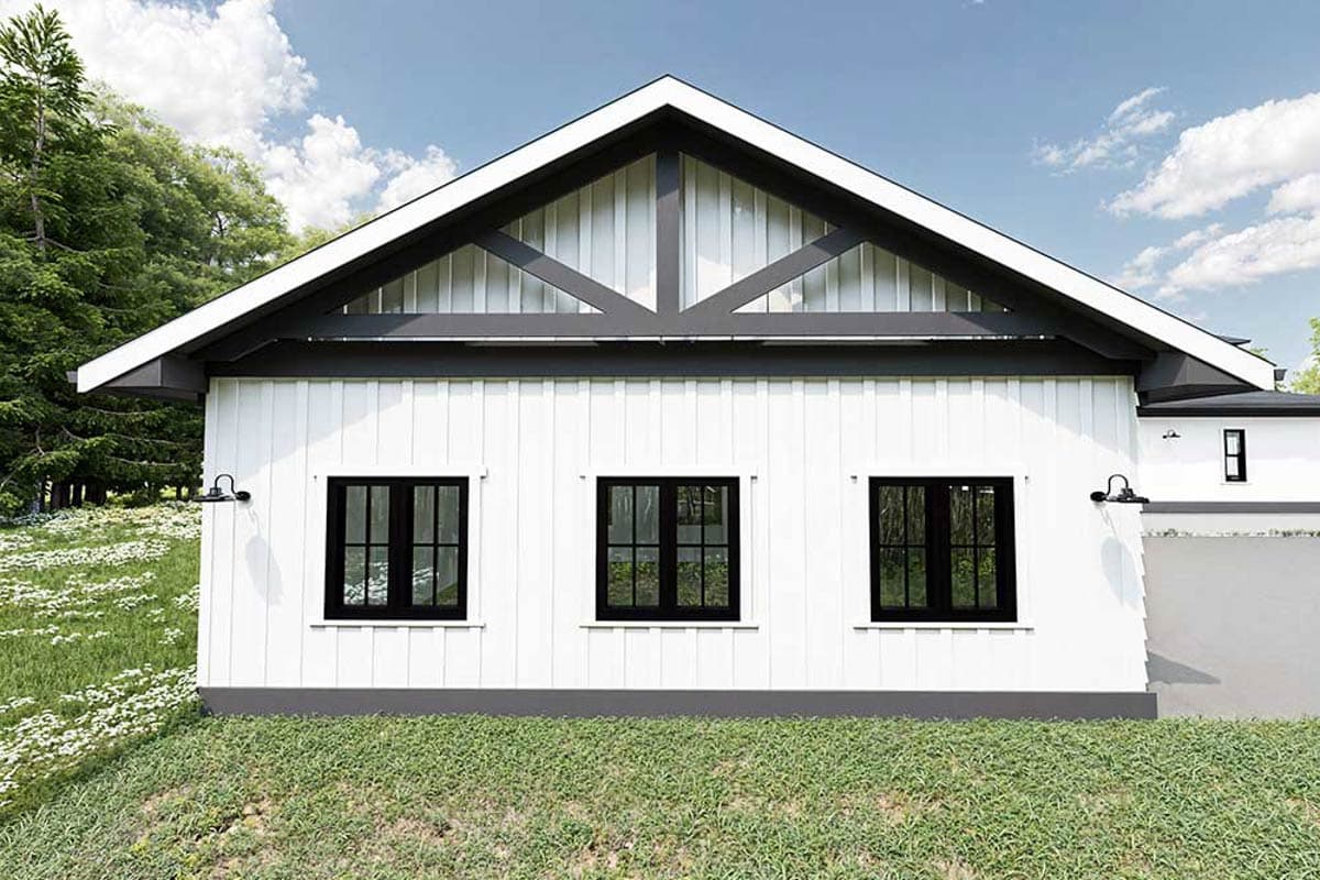 Modern Farmhouse house plan exterior with white vertical siding, gable roof, and three black-framed windows.