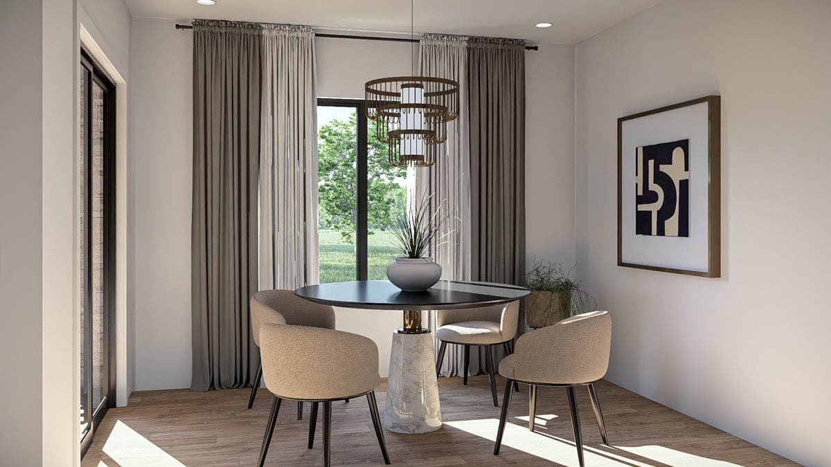 Dining room with round table, four chairs, large window, layered curtains, and modern art.