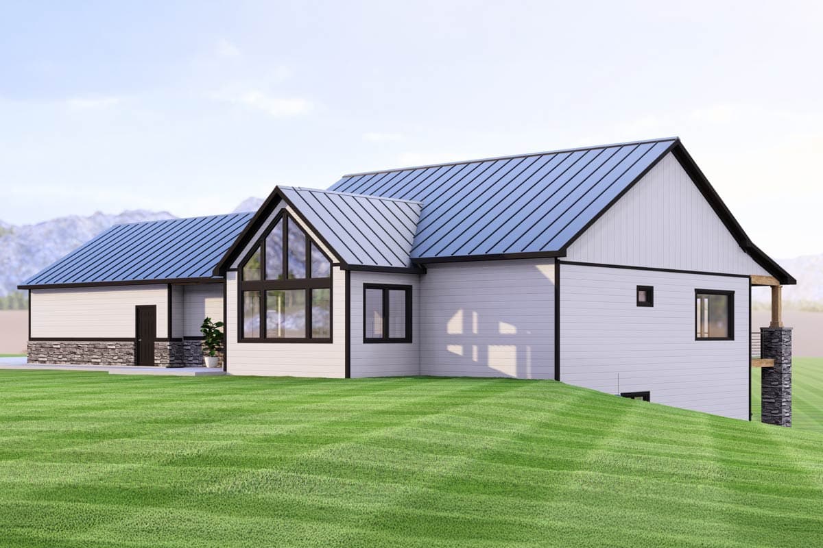 Modern house plan exterior: one story, white siding, metal roof, large gable window, stone base, and attached garage.
