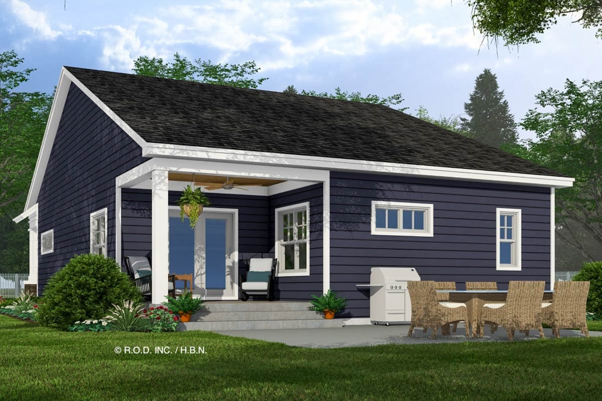 House plan exterior: one-story, dark blue siding, covered porch with columns, gabled roof, patio with outdoor dining set.